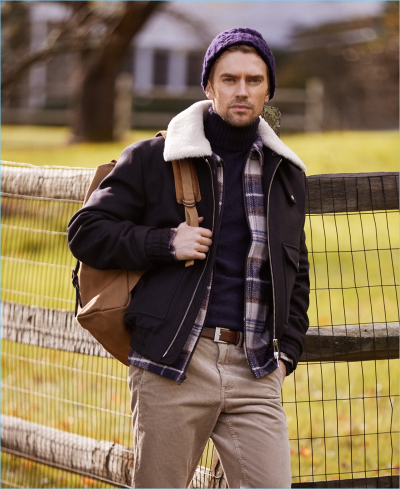 Make a chic impression with a Howlin' turtleneck sweater. It's perfection with an AMI jacket and Stüssy plaid shirt. East Dane completes the look with a HUGO belt, Filson backpack, and Norse Projects corduroy pants.