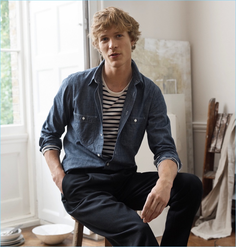 Sven de Vries wears a Mr P. selvedge chambray shirt, striped t-shirt, and chinos.