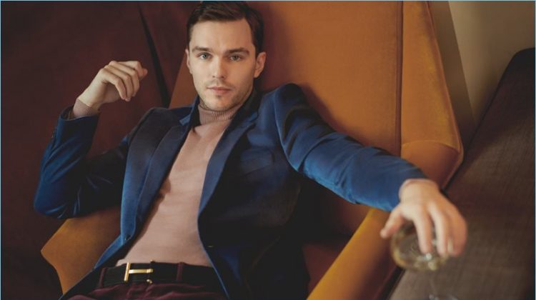 Nicholas Hoult wears a Paul Smith velvet blazer with an Oliver Spencer turtleneck sweater. He also dons Valentino corduroy trousers and a Tom Ford belt.