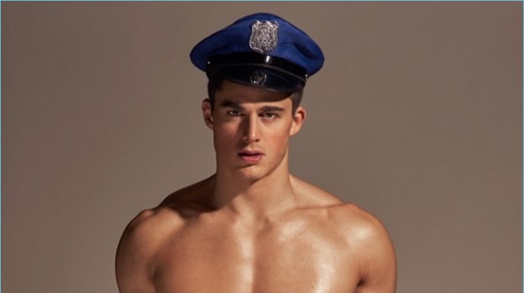 Pietro Boselli dresses up as a cop for a BENCH/ Body underwear promo image.