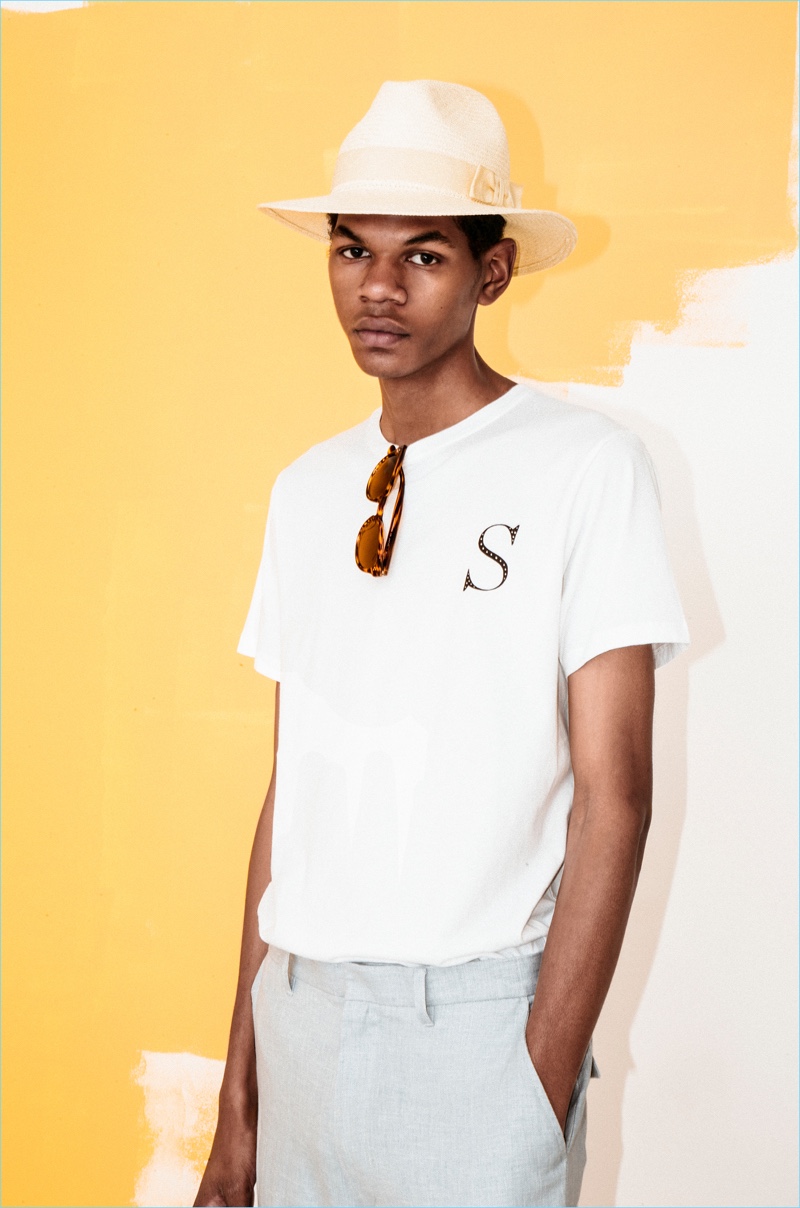 Play it casual in a Saturdays NYC printed t-shirt and sky-blue linen trousers.