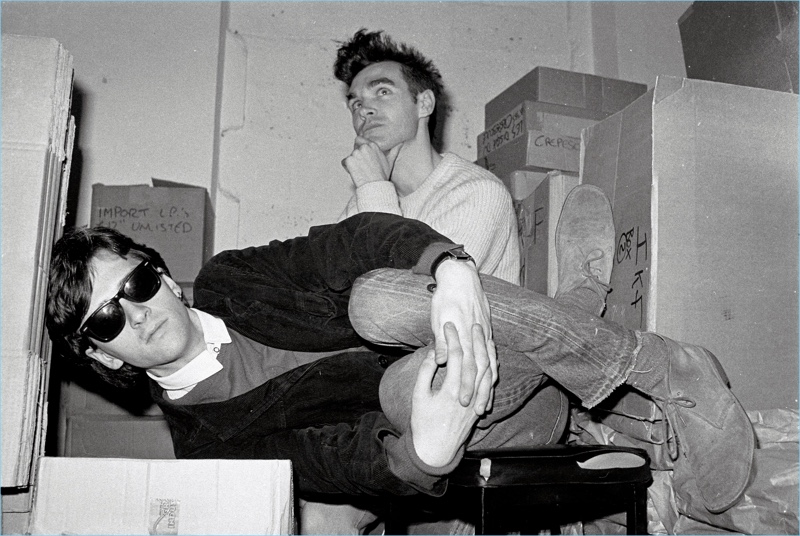 Johnny Marr and Morrissey  of The Smiths pose for a picture. Marr wears Ray-Ban Wayfarer sunglasses.