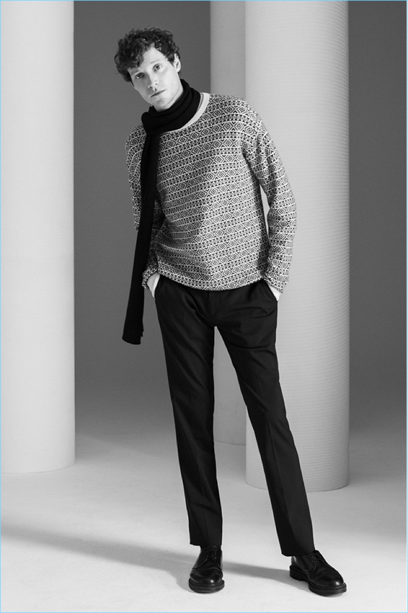 Dressed for winter, Matthew Hitt wears a Theory cashmere fair isle sweater and scarf. Theory’s stretch wool Jake pants complete the look.