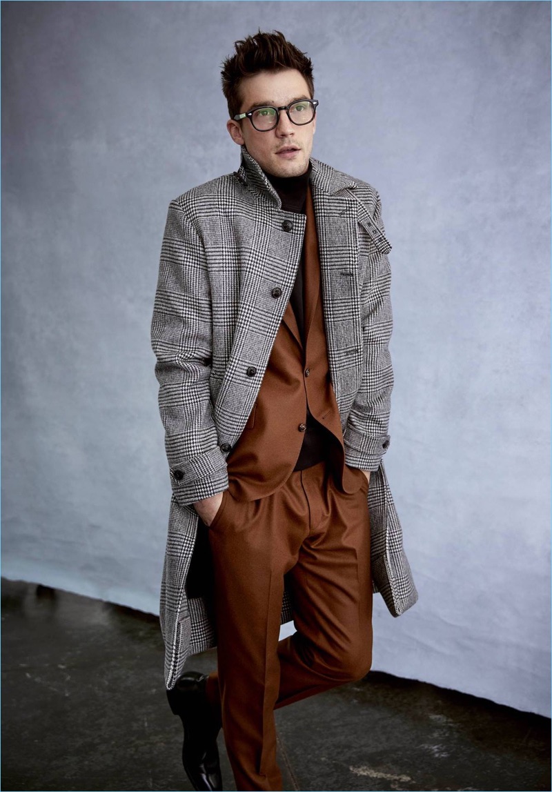 Todd Snyder not only features a rich Italian acorn brown flannel suit but a glen plaid topcoat.