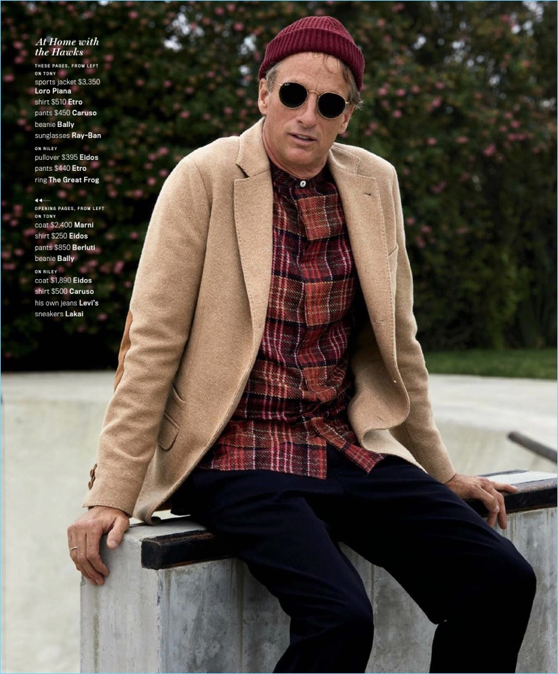 Linking up with GQ Style, Tony Hawk wears a Loro Piana sport coat with an Etro shirt. Caruso pants, a Bally beanie, and Ray-Ban sunglasses complete his look.