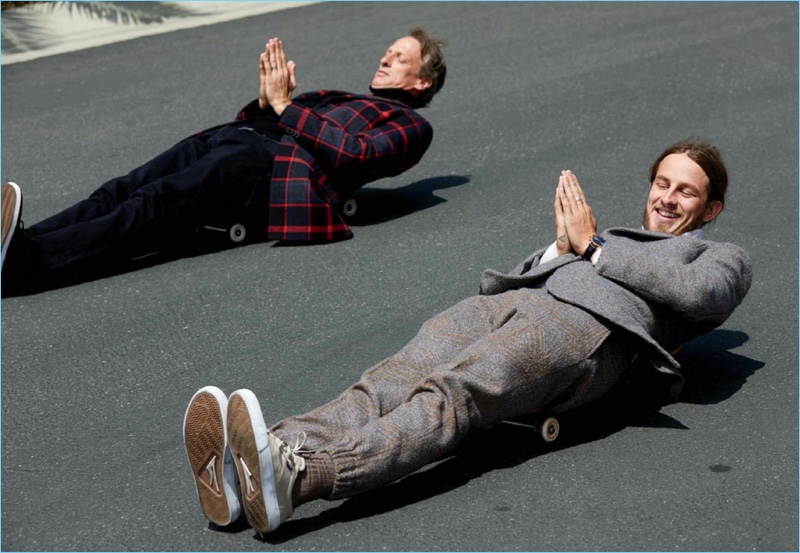 Michael Schmelling photographs Tony and Riley Hawk for GQ Style. Tony wears a coat and turtleneck by HUGO with his own Levi's jeans. Meanwhile, Riley sports an Ermenegildo Zegna Couture suit his own Lakai sneakers.