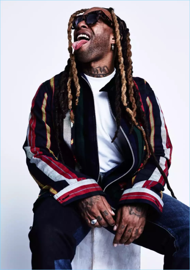 Ty Dolla $ign wears a striped Sacai jacket with Nudie Jeans jeans.