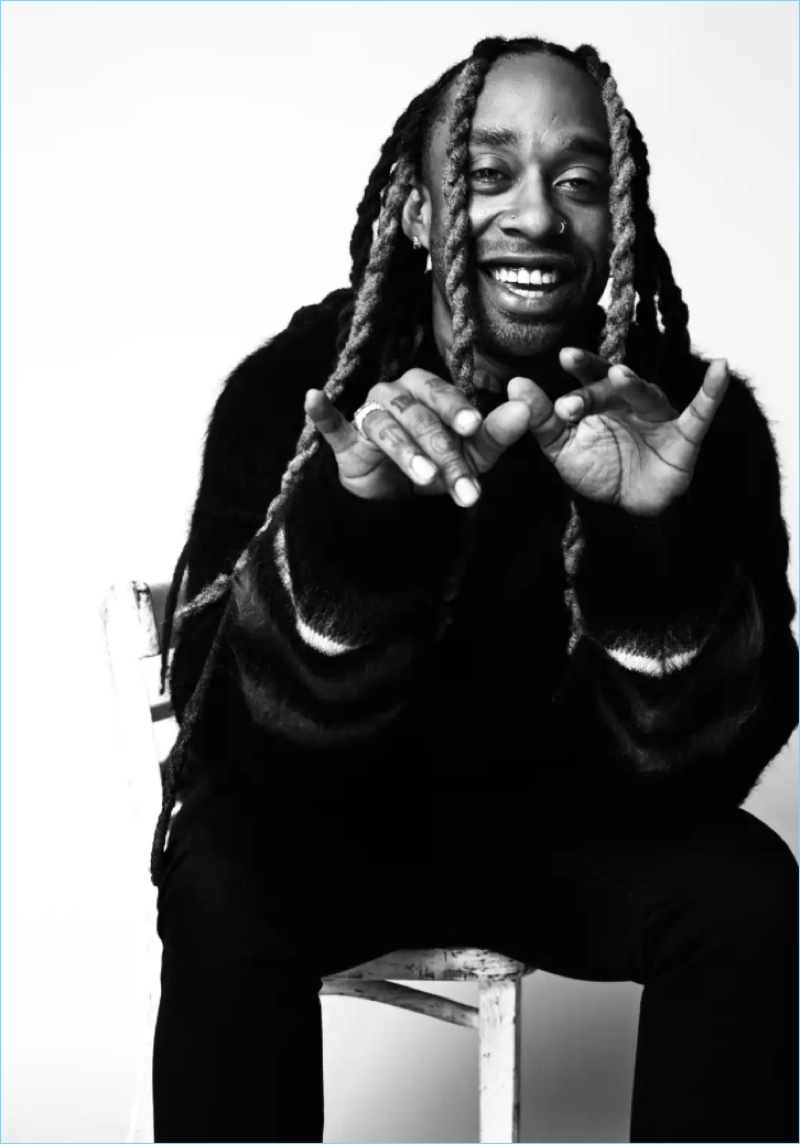 All smiles, Ty Dolla $ign wears a Loewe sweater.