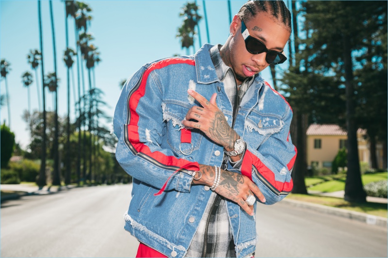 Rapper Tyga reunites with boohooMAN for a new collaboration. One essential item from the lineup is a denim jacket with zippered details.