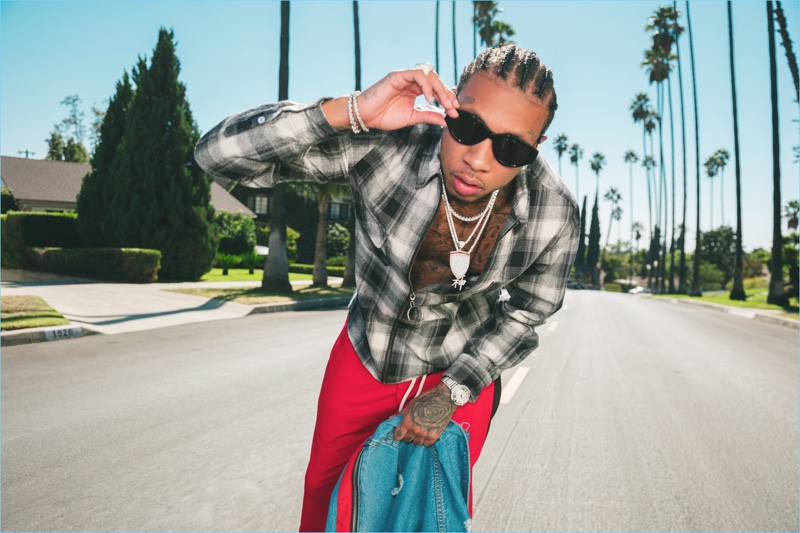 BoohooMAN reconnects with Tyga for a new collaboration. The outing revisits staples like the plaid shirt.