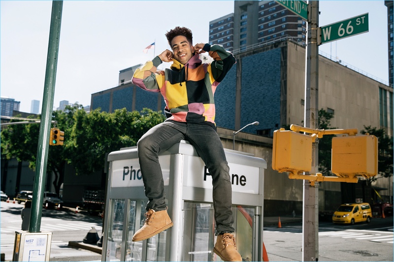 Wearing UGG Neumel Twinface Chukka boots, KYLE stops by the last phone booth in New York City.