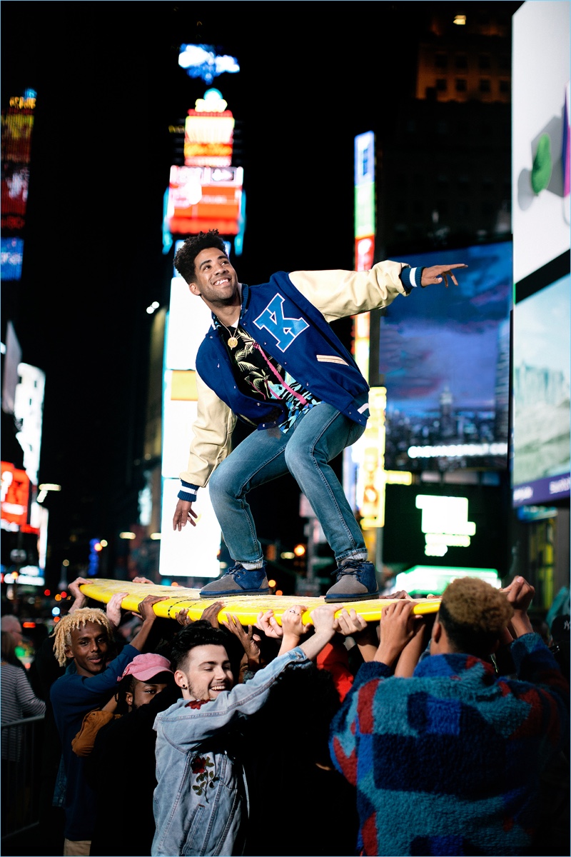 Crowd surfing, KYLE wears UGG Neumel color block boots.