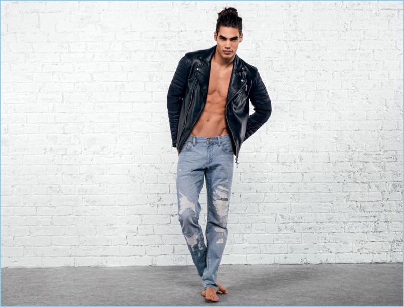 Vito Basso rocks an Armani Exchange leather jacket and denim jeans.