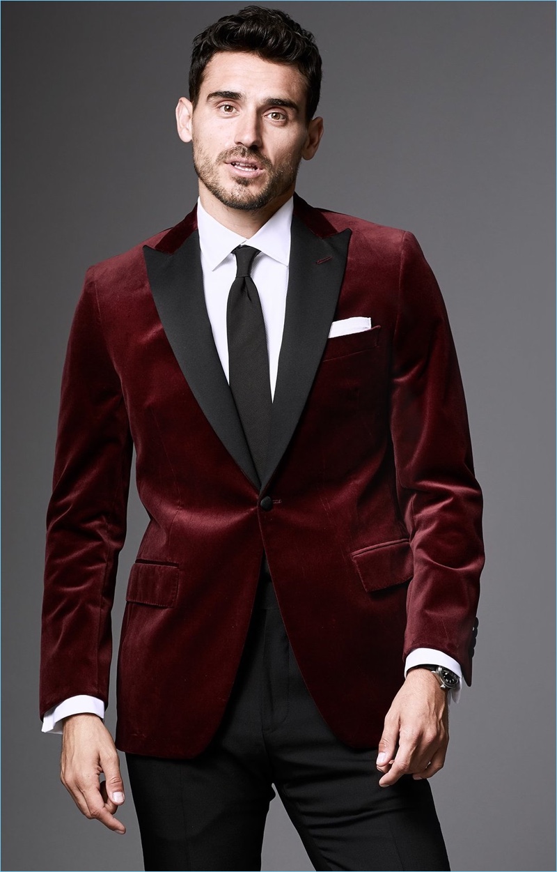 A Festive Affair: Dressed to impress, Arthur Kulkov dons a Todd Snyder tuxedo jacket in burgundy Italian velvet.