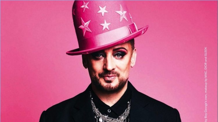 Sporting another one of his own hats, Boy George rocks a Maison Margiela shirt with a Pebble London necklace and his own pieces.