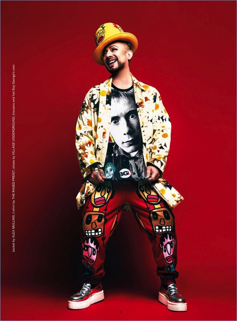 Exploding with personality, Boy George wears an Alex Mullins jacket with a t-shirt by The Raged Preist. He also wears Village Underground shoes with his own trousers and hat. » Boy George Brings Colorful Style to Gay Times Cover Shoot, Talks Upcoming Music Exploding with personality, Boy George wears an Alex Mullins jacket with a t-shirt by The Raged Preist. He also wears Village Underground shoes with his own trousers and hat.