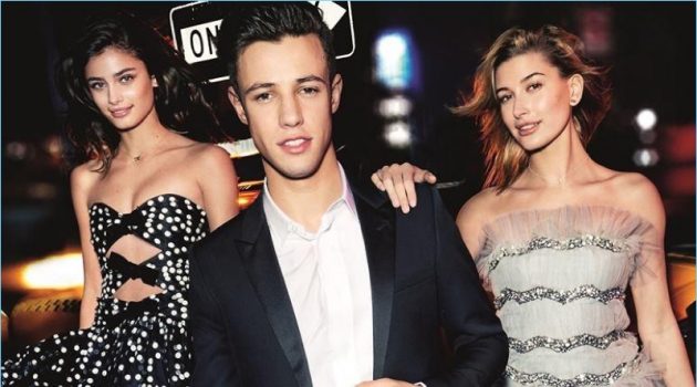 Cameron Dallas Fronts Carolina Herrera 212 VIP Black Fragrance Campaign Mario Testino photographs Taylor Hill, Cameron Dallas, and Hailey Baldwin for Carolina Herrera's 212 VIP Black campaign.
