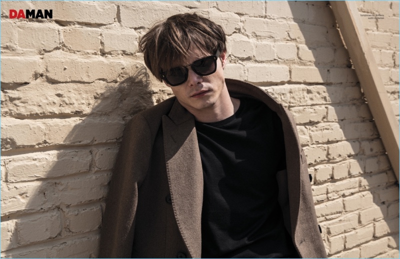 A cool vision, Charlie Heaton rocks Illesteva sunglasses with a Berluti outfit.