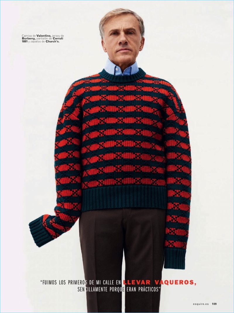 Actor Christoph Waltz wears a Valentino sweater, Burberry shirt, and Cerruti 1881 pants.
