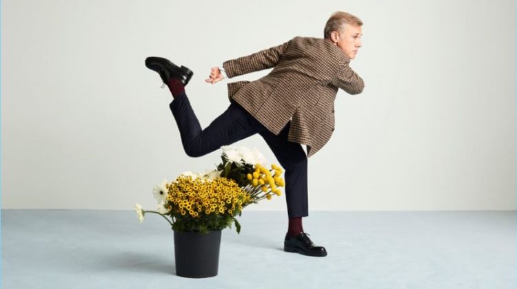 Actor Christoph Waltz wears an Incotex blazer, Sandro trousers, and AMI shoes.