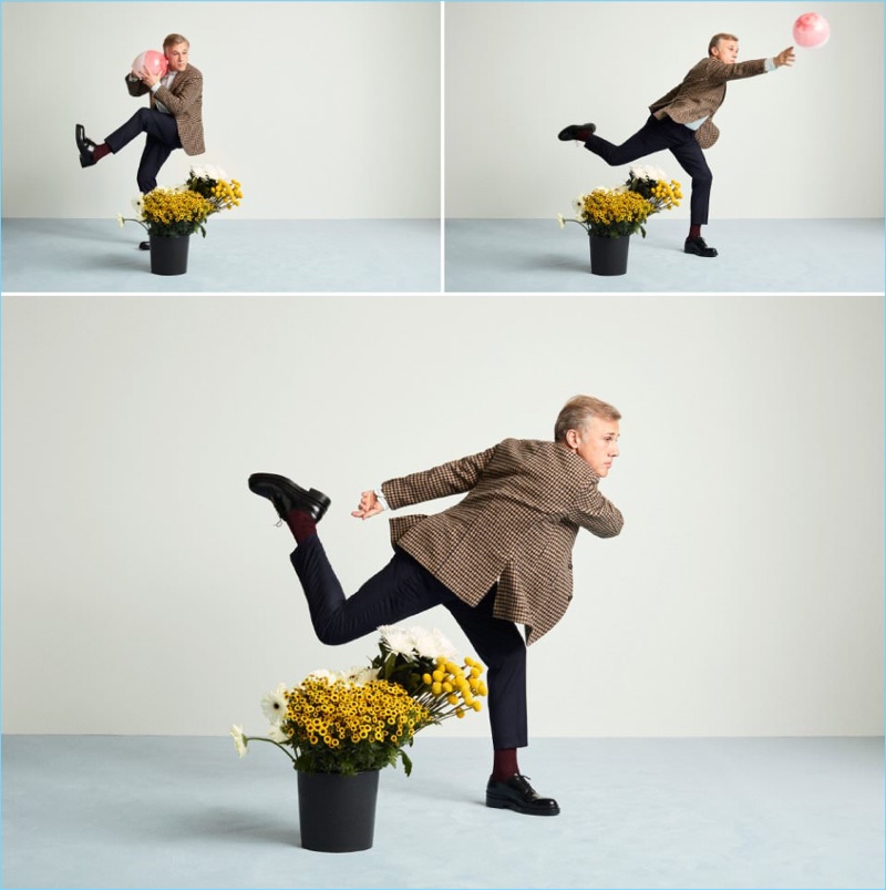 Actor Christoph Waltz wears an Incotex blazer, Sandro trousers, and AMI shoes.