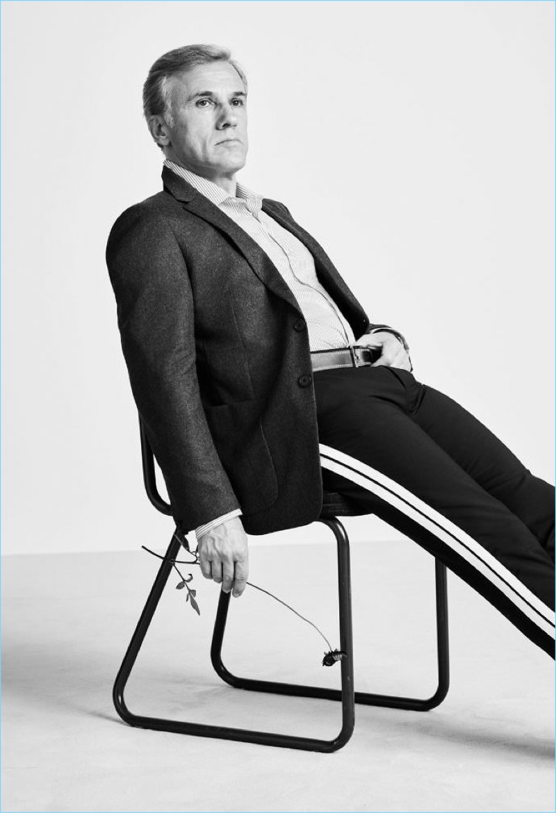 Sitting for a photo, Christoph Waltz sports a Prada blazer, Joseph shirt, Valentino trousers, and Loewe belt. » Christoph Waltz Stars in Quirky Mr Porter Shoot, Talks Female James Bond & 'Georgetown' Sitting for a photo, Christoph Waltz sports a Prada blazer, Joseph shirt, Valentino trousers, and Loewe belt.