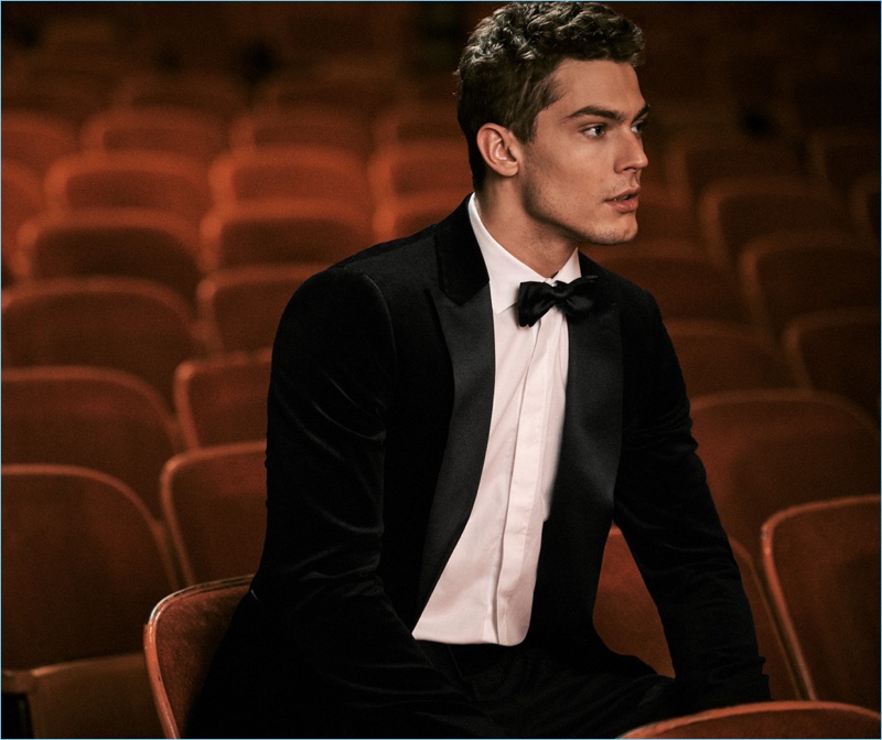 The New Year's Eve Event: Model Jacob Hankin wears a Theory tuxedo and shirt with a Salvatore Ferragamo leather belt.