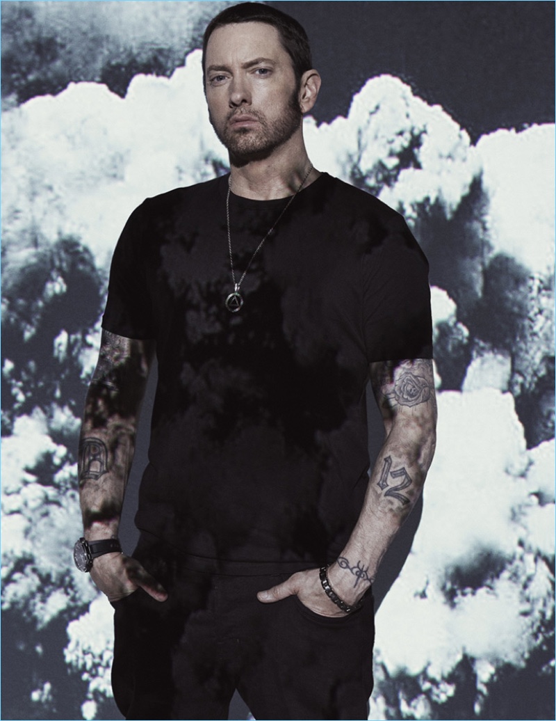 Rapper Eminem wears a Goodlife t-shirt with AllSaints pants.