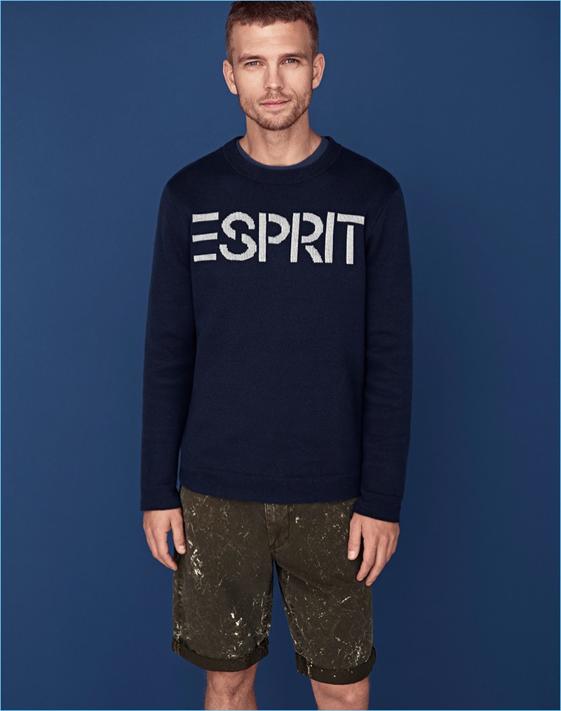 Sporting an Esprit logo pullover, Benjamin Eidem connects with the brand for spring-summer 2018.