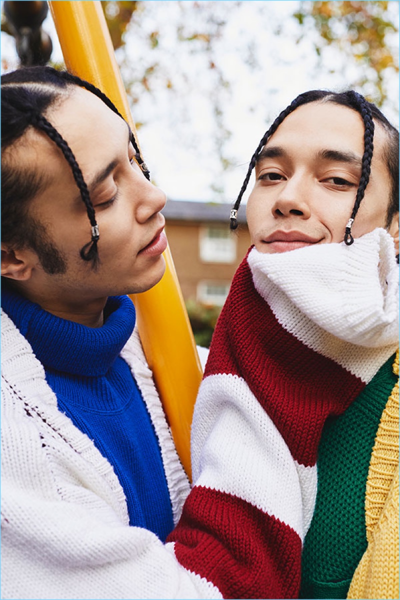 Twin brothers Clint and Lee layer in knits from Raf Simons, AMI, and Sacai.