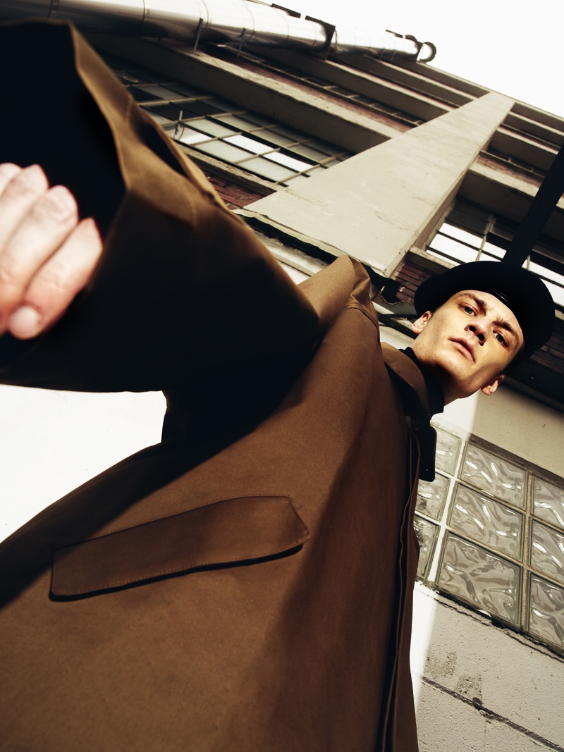 Marcel wears beret Alexander McQueen and coat Hed Mayner.