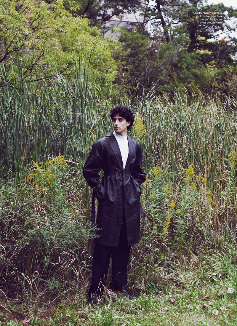 Reza wears coat Andrew Coimbra, pullover Hugo Boss, trousers Sandro, and shoes Cole Haan.