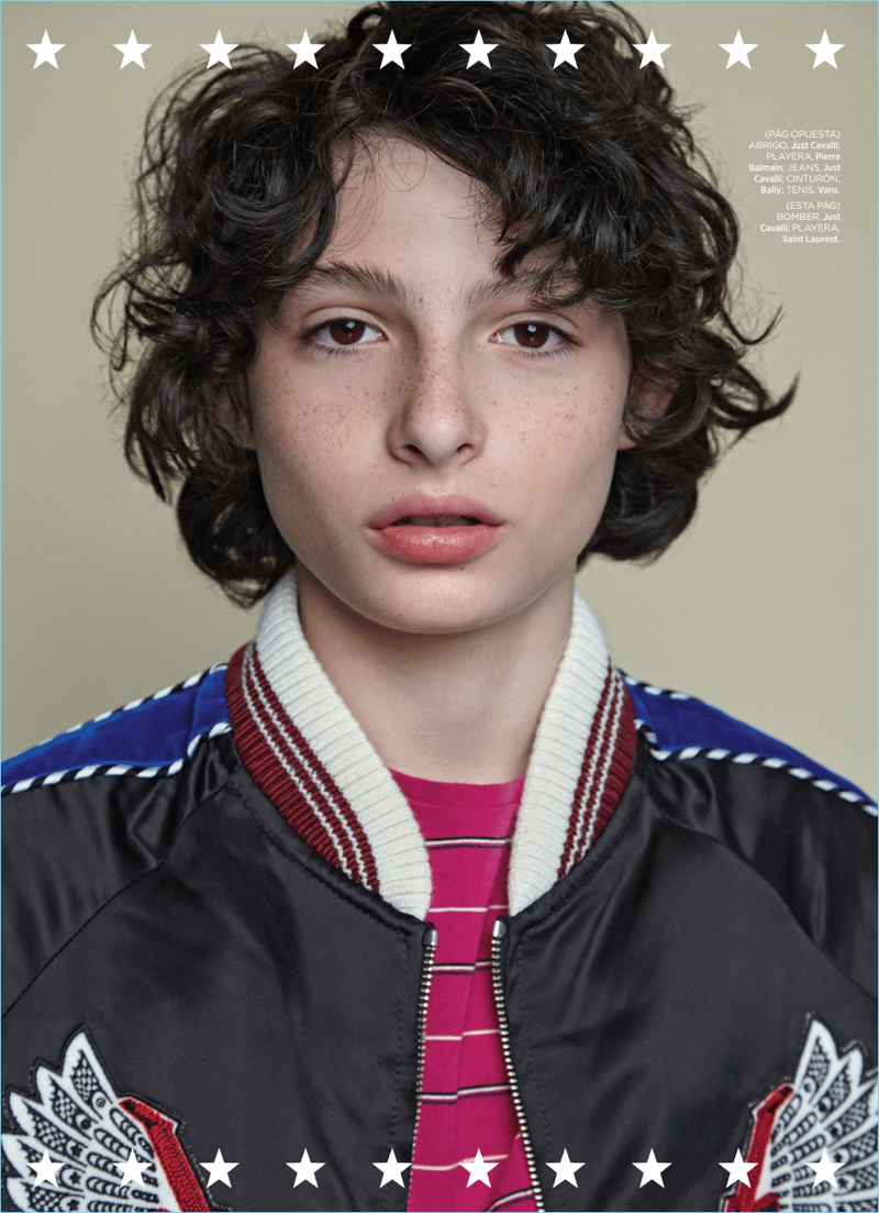 Rocking a Just Cavalli bomber, Finn Wolfhard also wears a Saint Laurent striped tee.