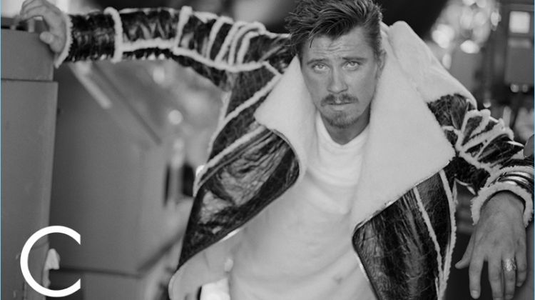 Actor Garrett Hedlund wears a Balmain jacket with a Buck Mason t-shirt.