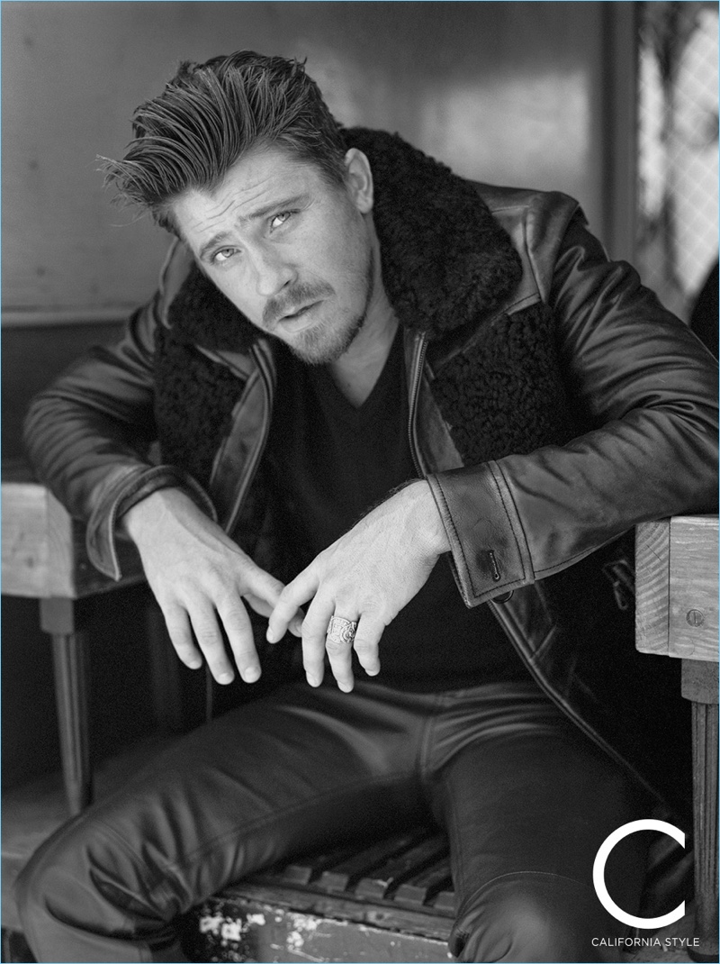 A cool vision, Garrett Hedlund sports a Prada leather jacket, sweater, and pants.
