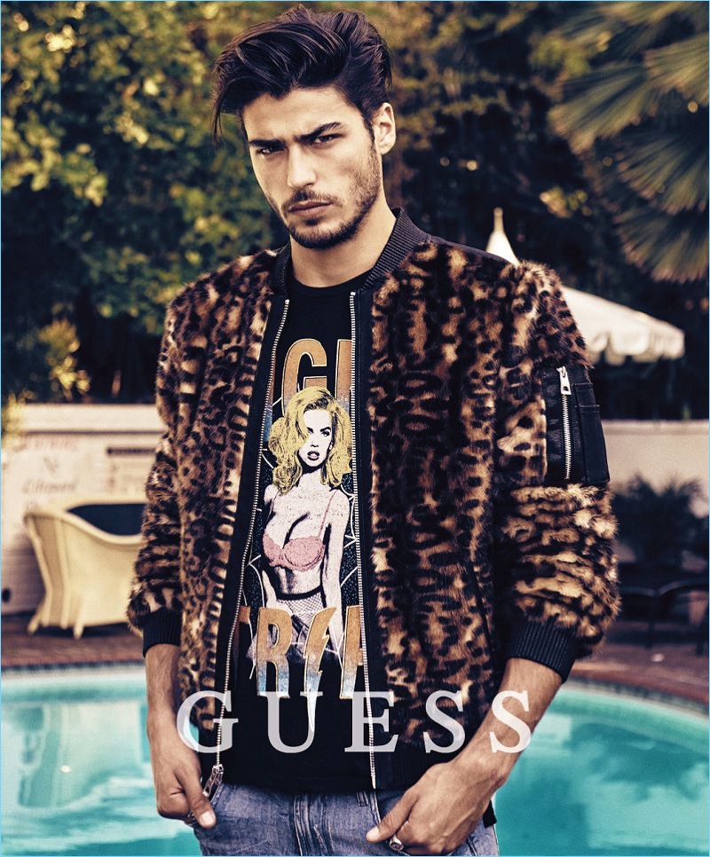 Alessandro Dellisola rocks a leopard print bomber jacket for Guess' holiday 2017 campaign.