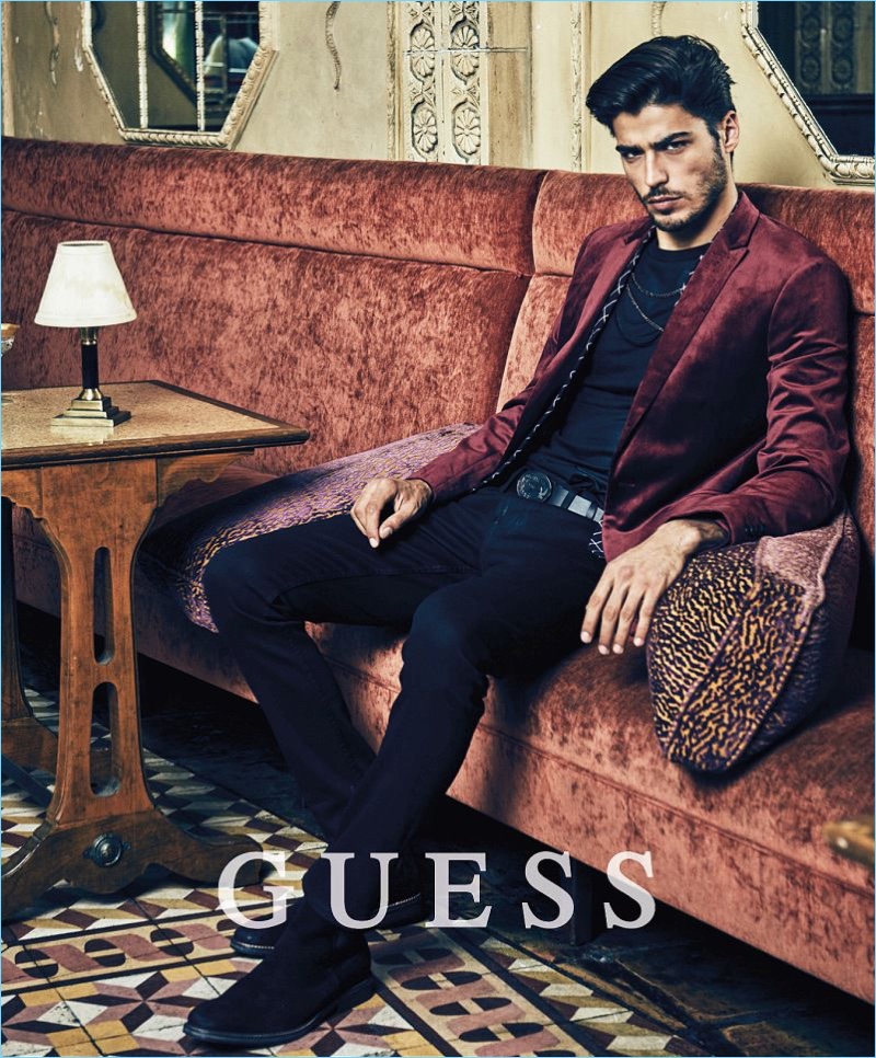 Sporting a velvet blazer, Alessandro Dellisola fronts Guess' holiday 2017 campaign.