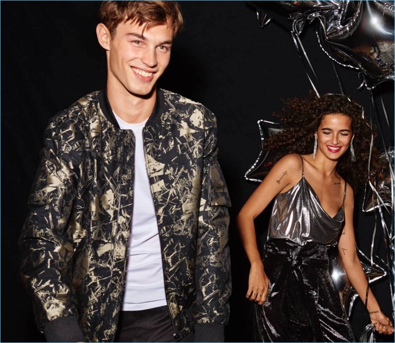 All smiles, Kit Butler wears a H&M jacquard-weave bomber jacket.