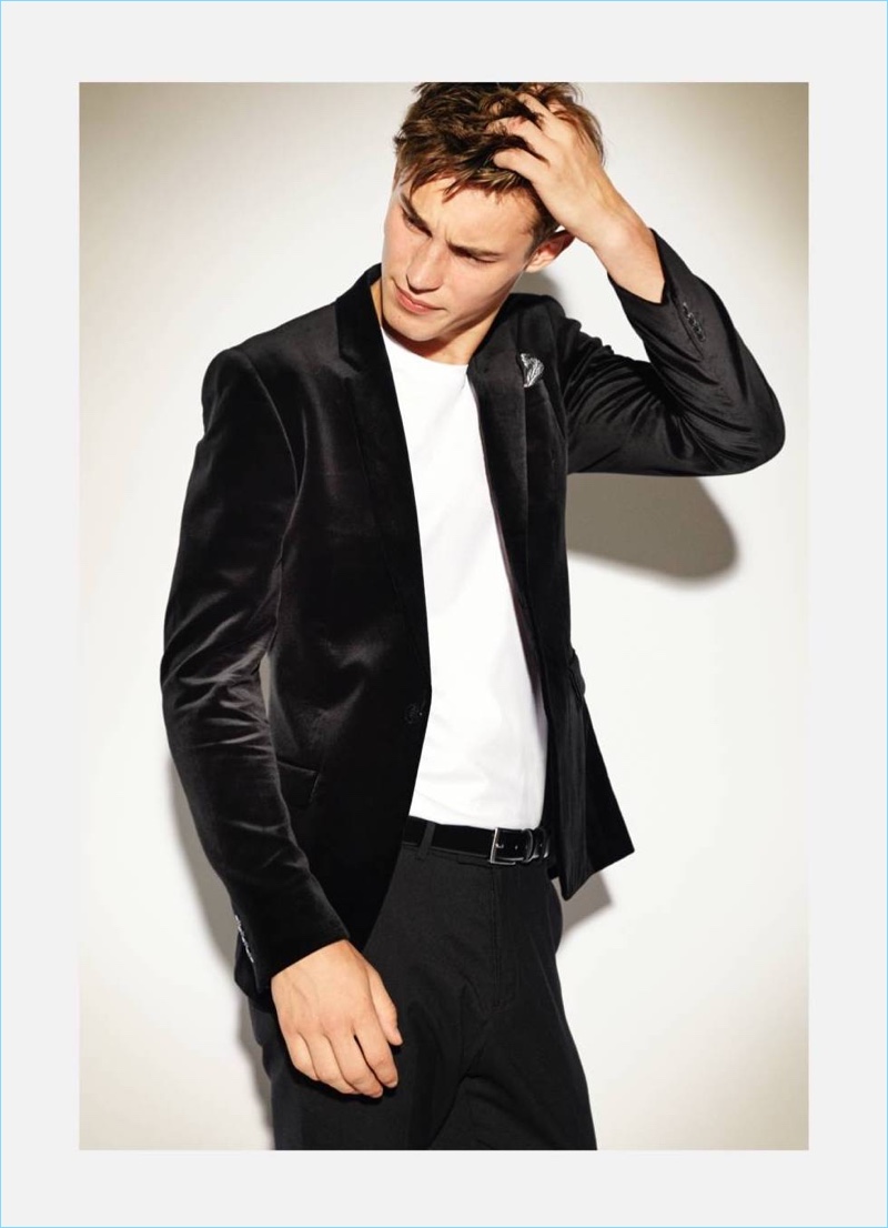 English model Kit Butler dons a H&M cotton velvet blazer with a plain t-shirt and trousers.
