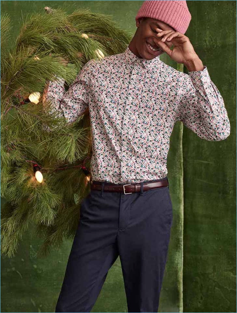 Model Hamid Onifade brings the holiday cheer for Simons' latest catalog.