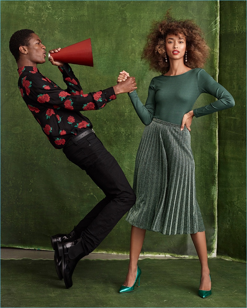 Embracing holiday sentiments, Hamid Onifade and Anaïs Mali wear fashions from Simons.