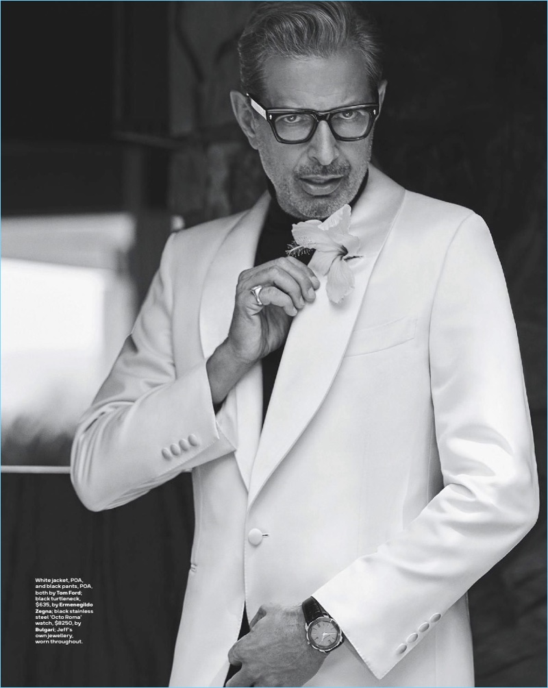 Dressed to impress, Jeff Goldblum wears a white jacket and pants by Tom Ford. Goldblum also rocks an Ermenegildo Zegna turtleneck.