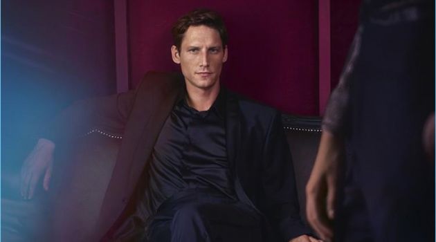 Roch Barbot Stars in Jimmy Choo Cruise '18 Campaign Model Roch Barbot wears Jimmy Choo black brushed off leather loafers with rabbit fur.