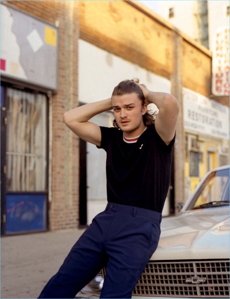 Stranger Things star Joe Keery wears a Givenchy top with Louis Vuitton pants.