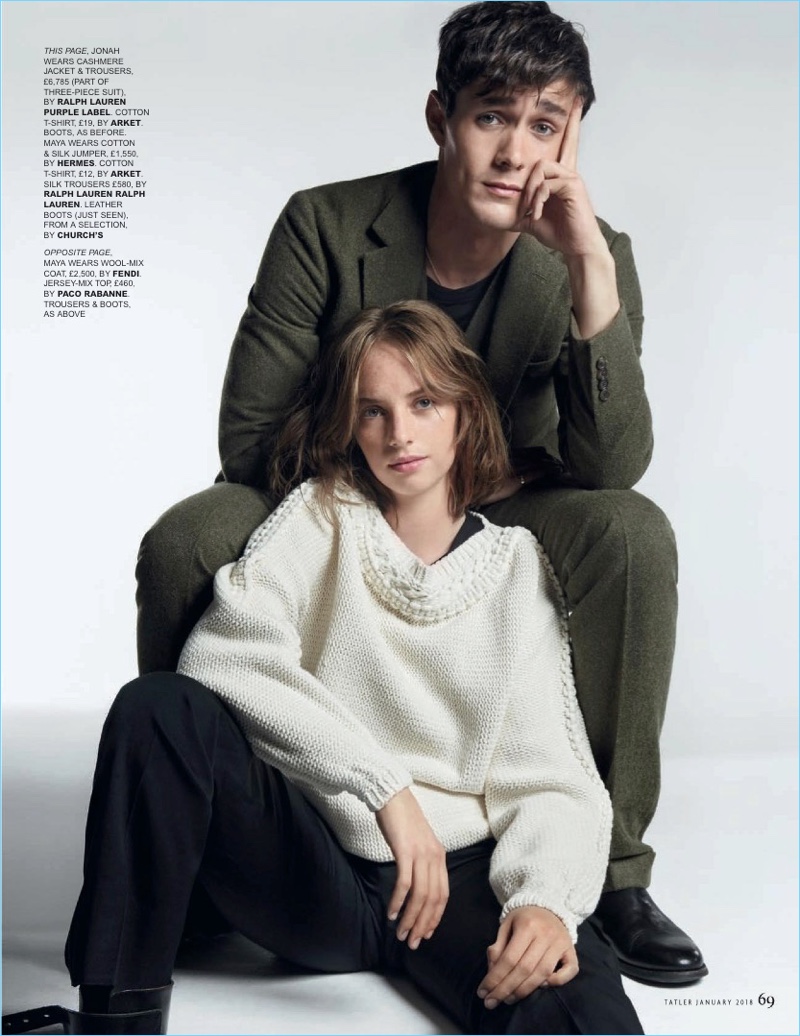 Jonah Hauer-King poses for a picture with Maya Hawke. He wears a suit by Ralph Lauren Purple Label and an Arket t-shirt.