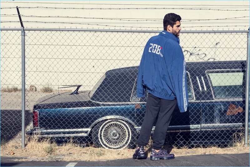 Connecting with The Webster, Landon Falgoust wears Vetements. He models a Vetements x Reebok track jacket and Highlighted Pump sneakers with Vetements jogging pants.