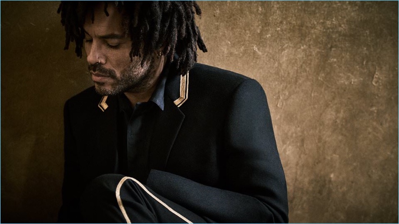 Stealing a quiet moment, Lenny Kravitz wears a Saint Laurent blazer with a Haider Ackermann overshirt.