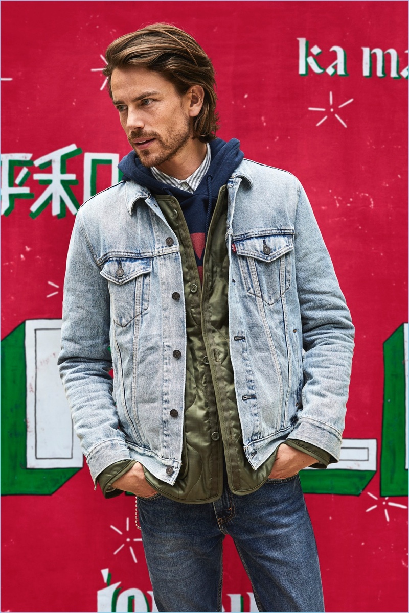 Jeremy Young rocks Levi's iconic denim trucker jacket.