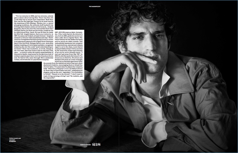 French actor Louis Garrel dons a shirt and trench coat by Burberry.