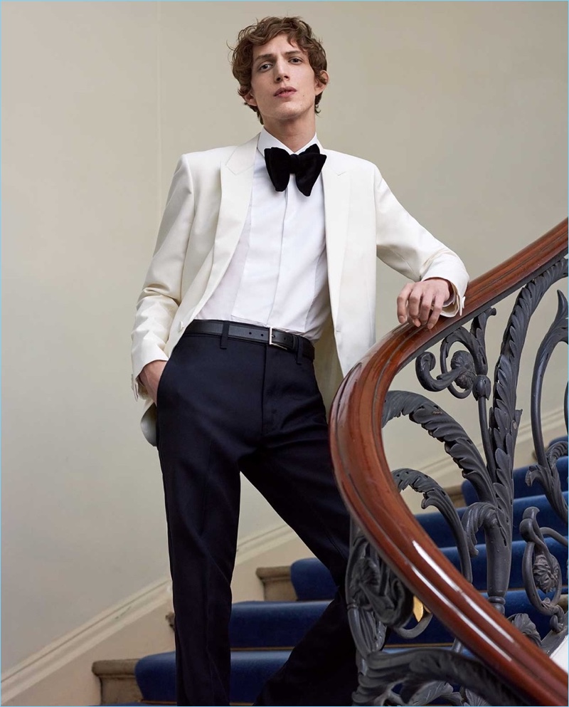 Dressed for a formal event, Xavier Buestel wears a Saint Laurent tuxedo jacket with a Valentino shirt. He also dons Lemaire trousers and a Prada leather belt.